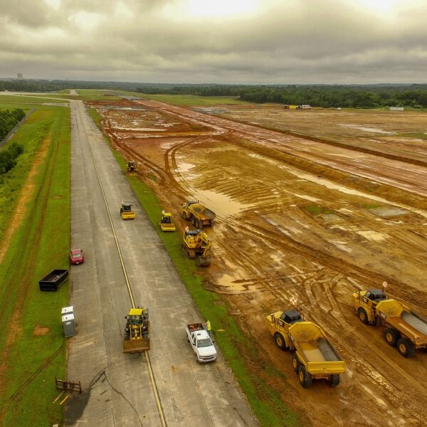 Workers getting runway ready for tarmac to be laid