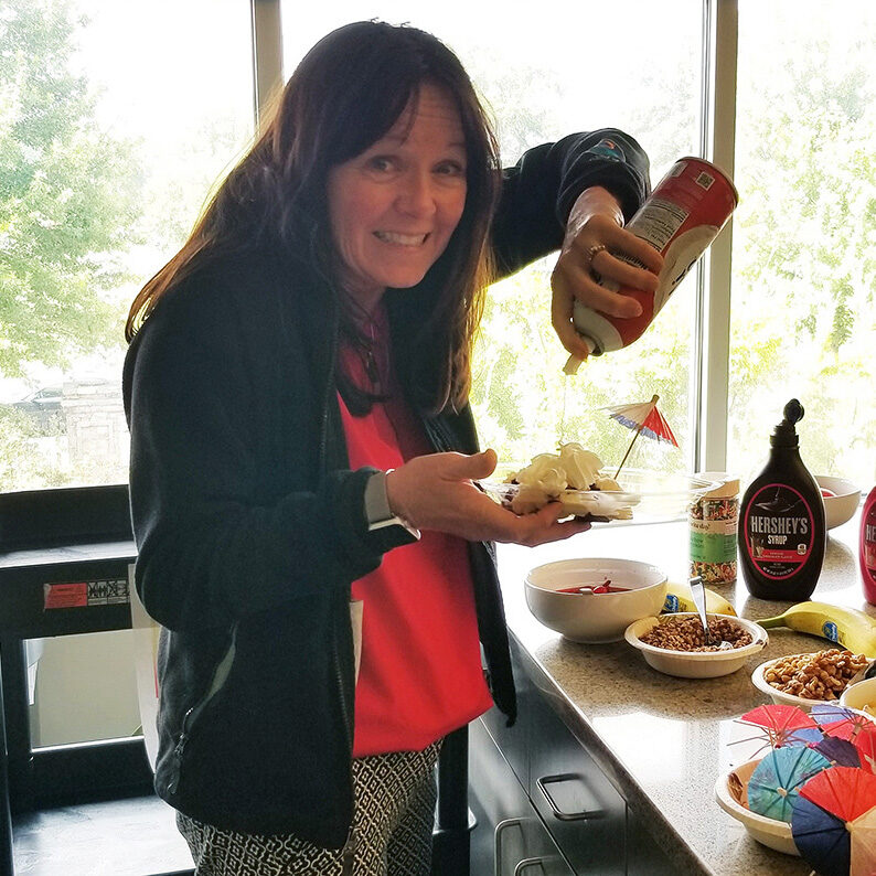 Lisa making a sundae